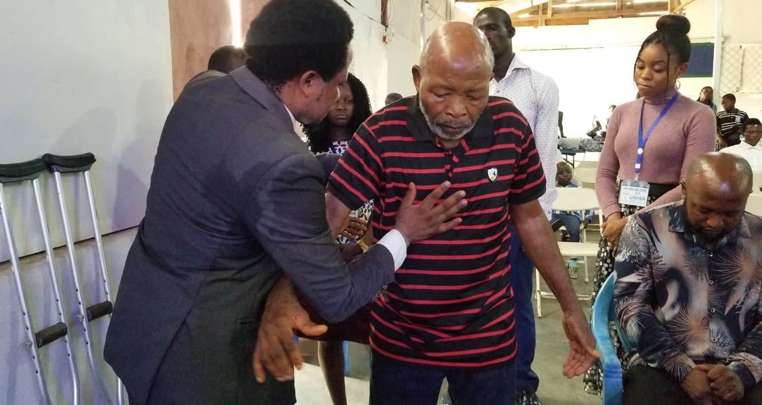 A moment of prayer and healing ministration during service.